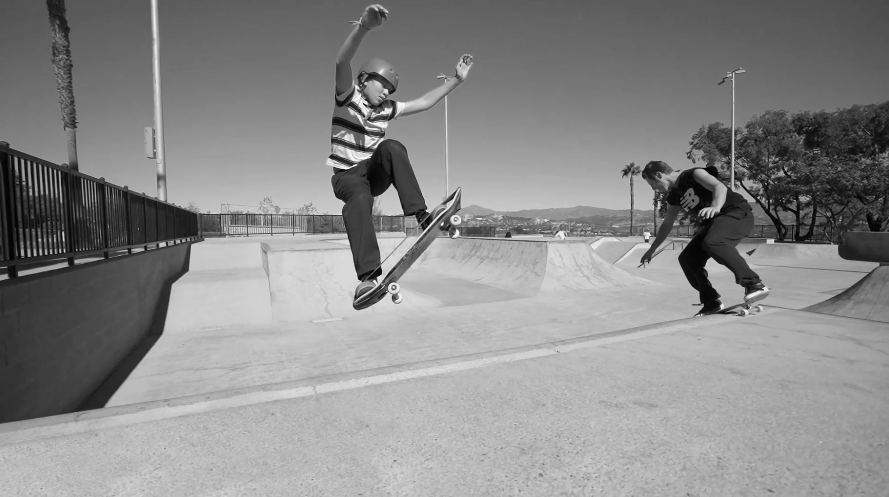 Kid doing aerial at skatepark